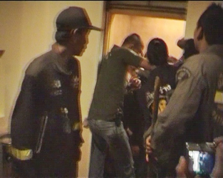 Rescue workers prize open the elevator doors to allow the trapped students to escape.